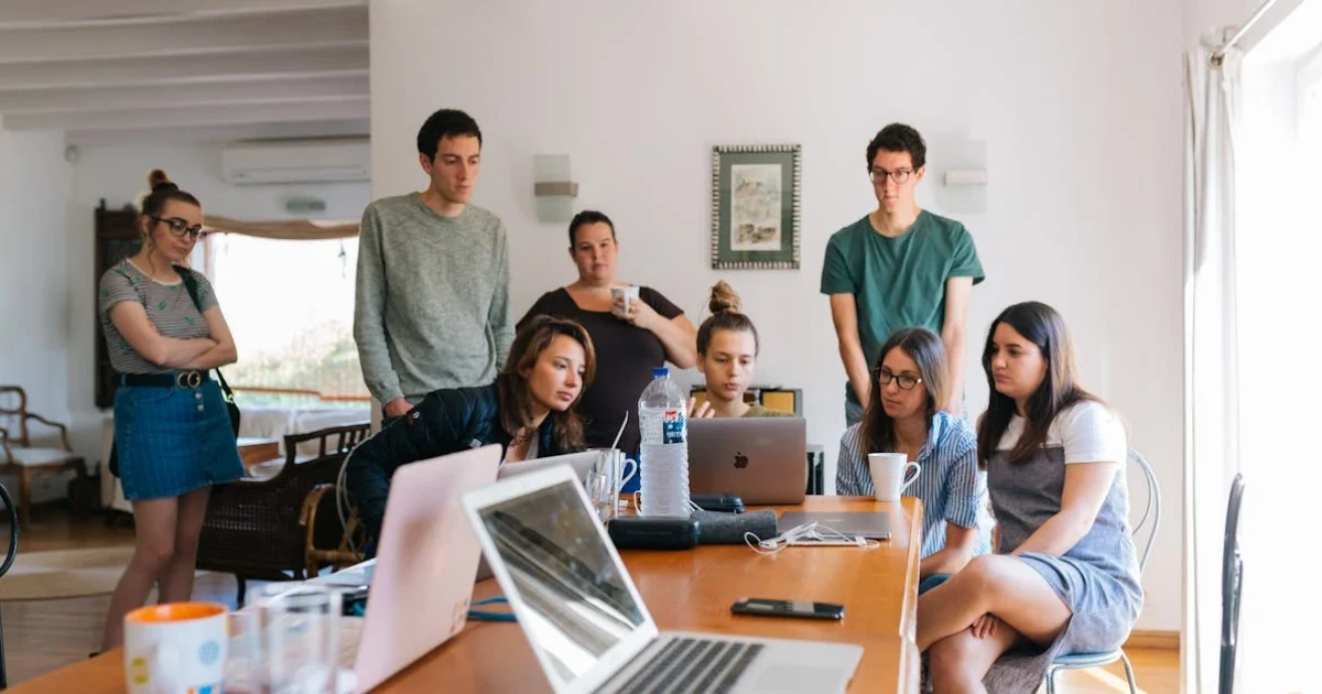 Group of People Watching on Laptop
